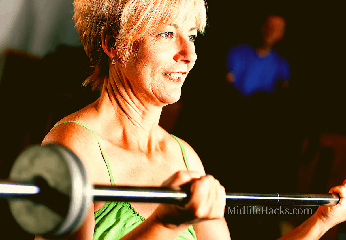 mature woman using barbells